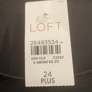 Black pull over blouse with button cuffs .  100% polyester.